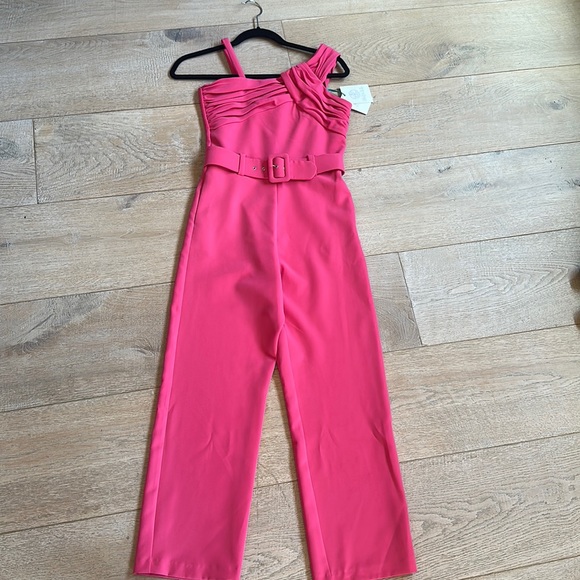 NEW WITH TAGS! Pink jumpsuit with matching belt.NEVER WORN!...